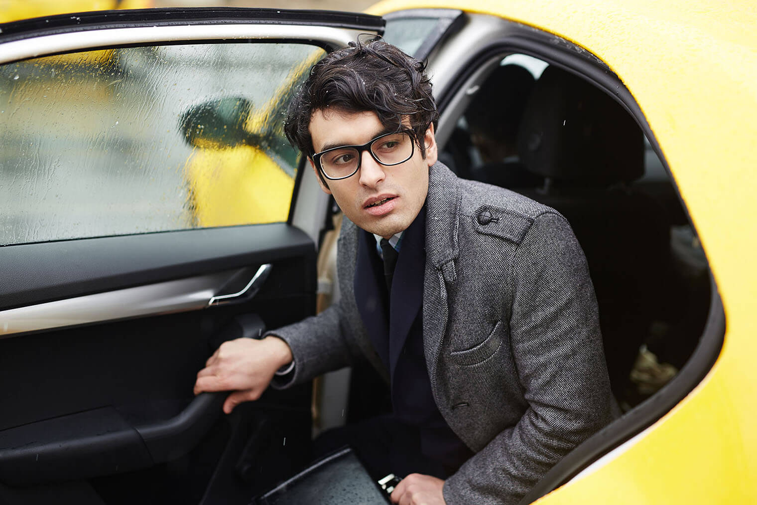 a person getting out of a taxi